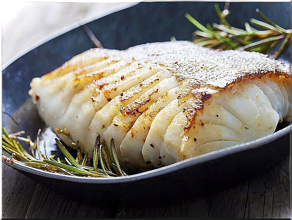 Baked sea bass with potatoes and onion 