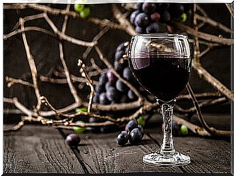 wine glass with grapes background