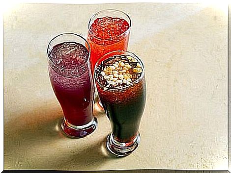 three grape juices with ice