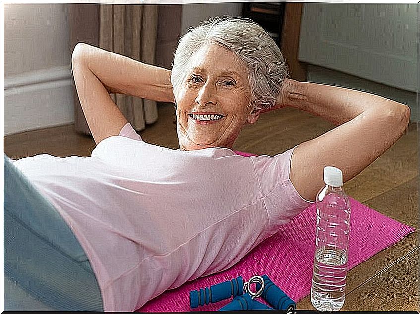 Lady exercising on her yoga mat.