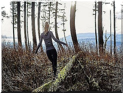 Woman walking in the forest