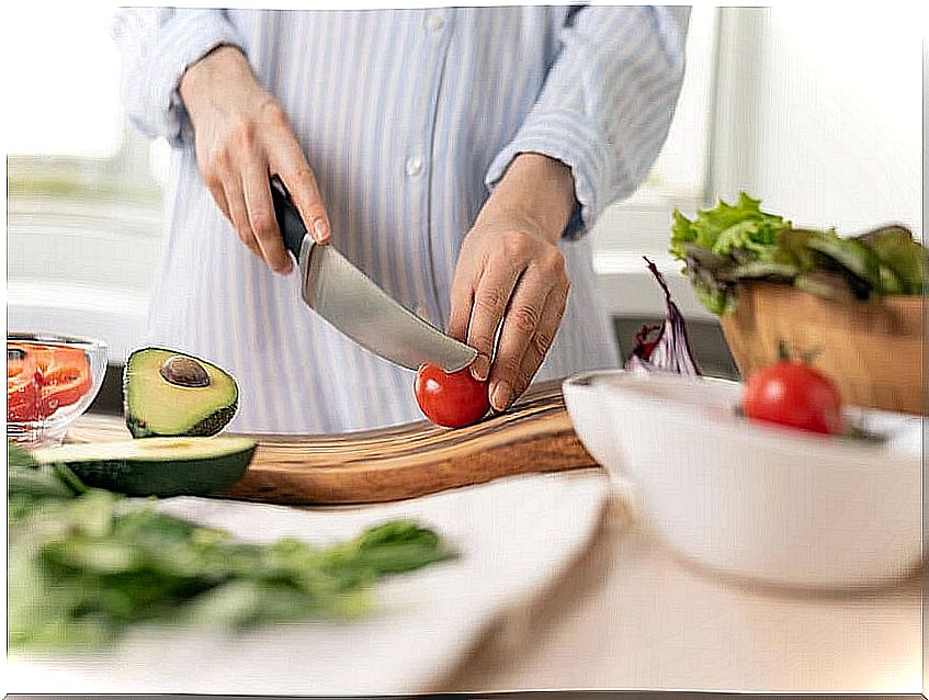 Woman cutting fresh food