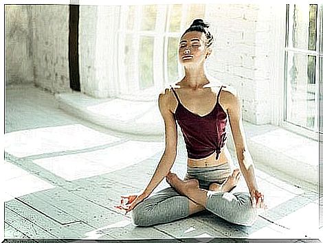 Woman meditating at home