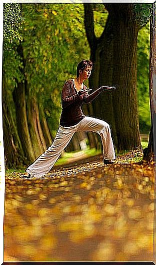 Woman doing yoga in the forest