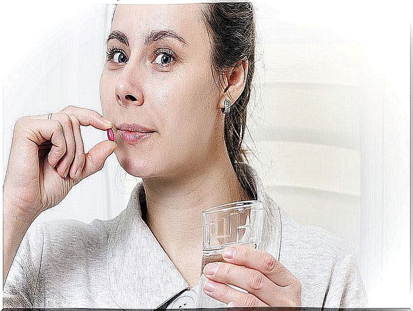 Woman taking pill