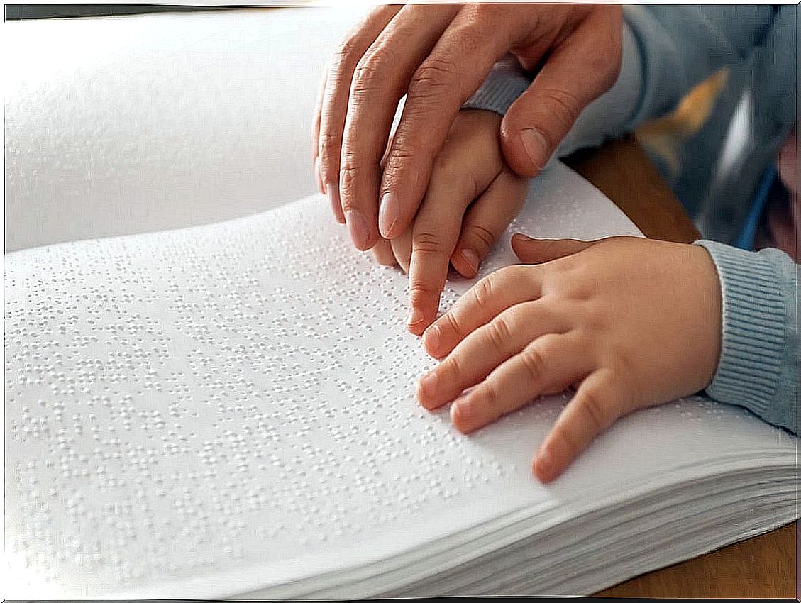 Braille reading for blind children.