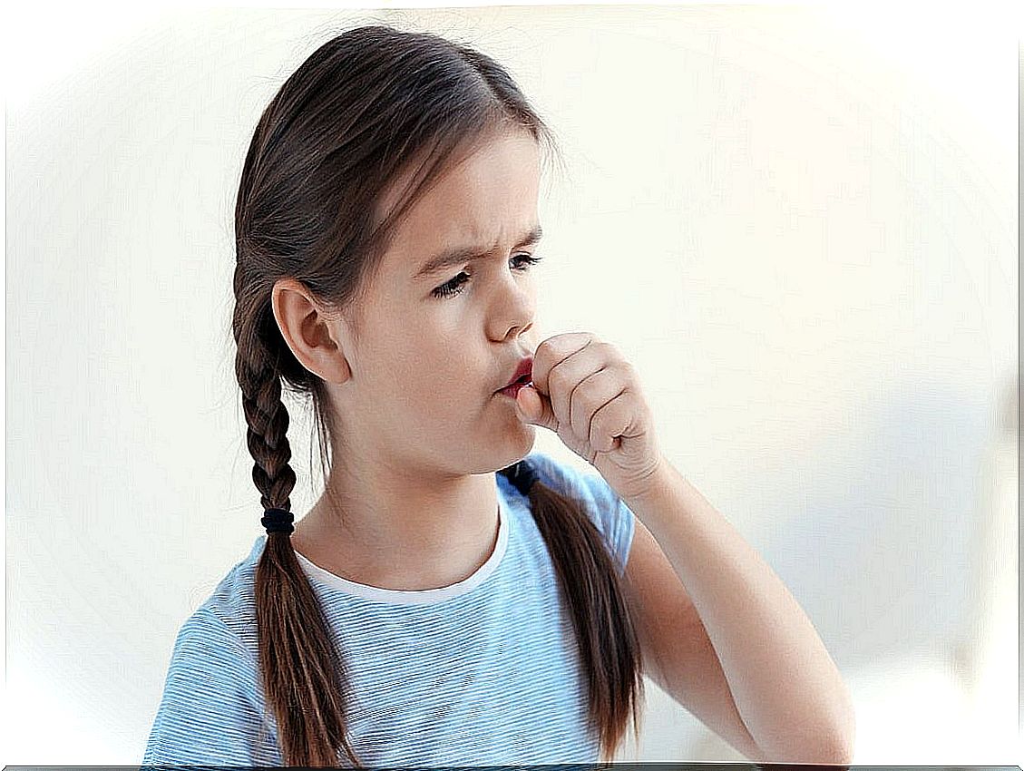 Girl coughs with respiratory infection.