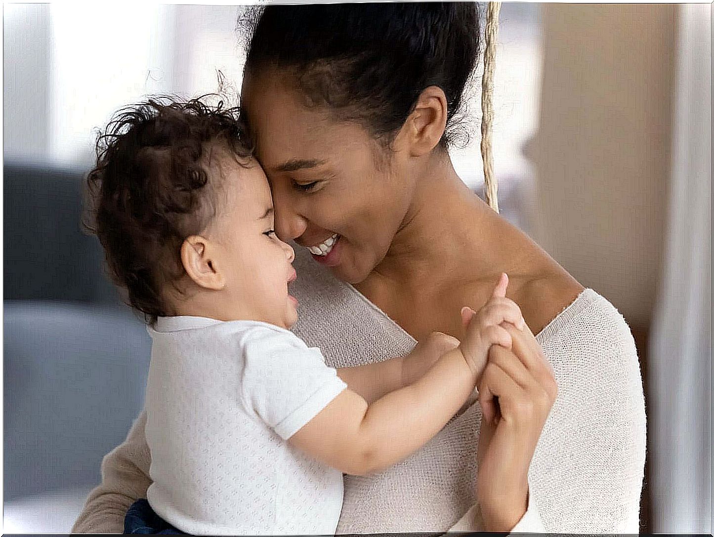 Mom talking to her and baby staring at her.